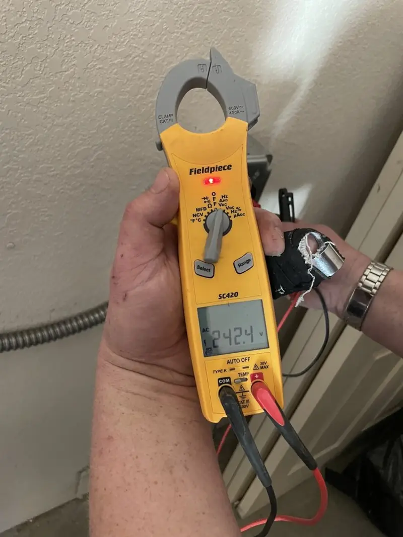 Voltage testing with clamp meter during Ceiling Fan Installation in Weehawken